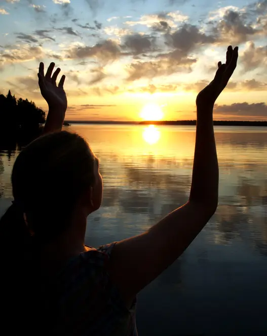 Woman Worshiping at sunset